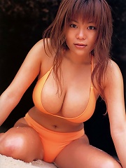 Voluptuous asian hottie at the beach in her skimpy little bikinis